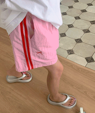 Carved bowknot track nylon shorts