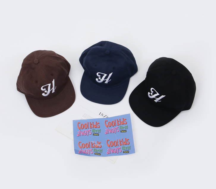 H embroidery cap (model wearing)